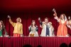 Actors raise a toast in medieval costumes